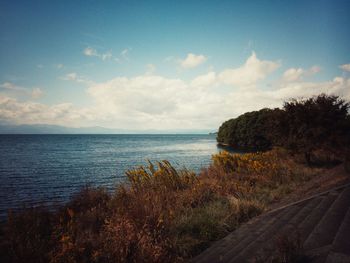 Scenic view of sea against cloudy sky