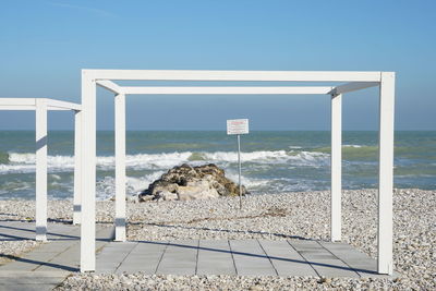 Scenic view of beach against clear sky