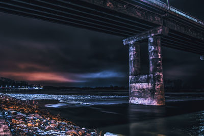 Low angle view of bridge over calm sea