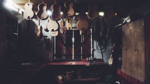 Illuminated lanterns hanging in kitchen