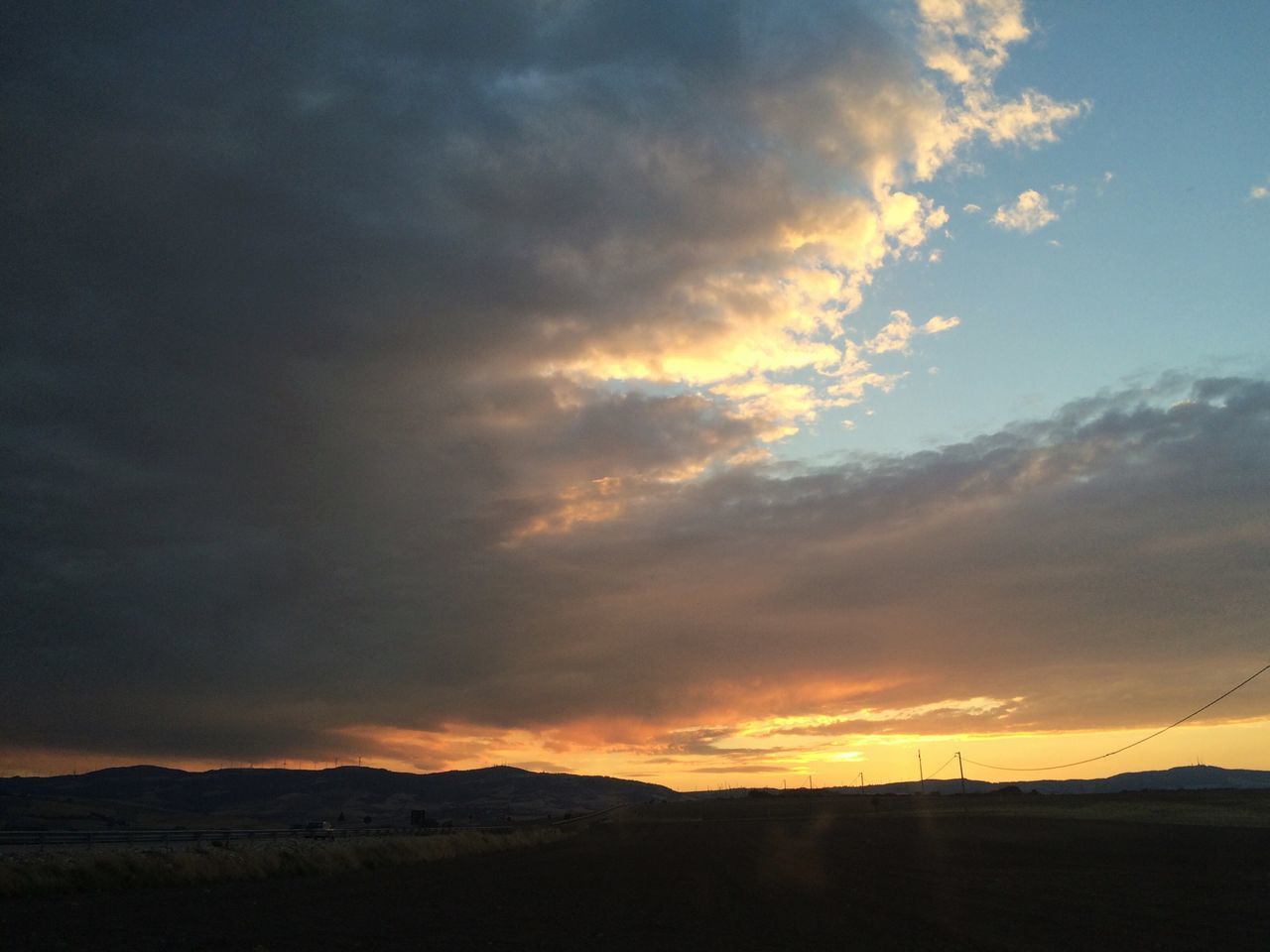 sunset, sky, tranquil scene, landscape, scenics, tranquility, silhouette, beauty in nature, cloud - sky, nature, cloud, orange color, idyllic, dramatic sky, cloudy, horizon over land, field, non-urban scene, mountain, dusk