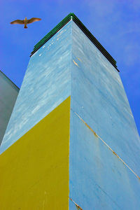 Low angle view of built structure against blue sky