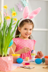 Portrait of boy playing with toys on table