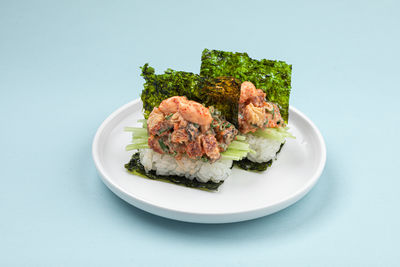 Close-up of food in plate on white background