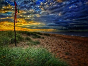 Scenic view of sea against cloudy sky