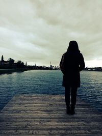 Rear view of a girl looking at sea