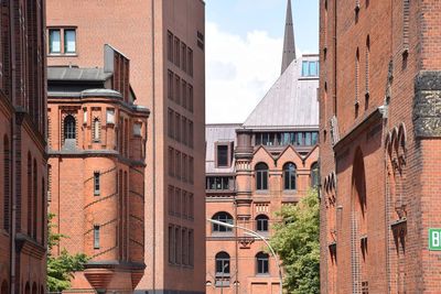 Low angle view of buildings in city against sky