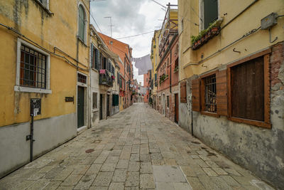 Narrow alley amidst residential buildings