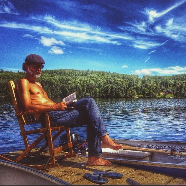 water, lifestyles, leisure activity, casual clothing, sky, sitting, tree, lake, relaxation, rear view, full length, young adult, standing, person, blue, river, nature, young men