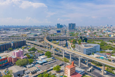 High angle view of buildings in city against sky