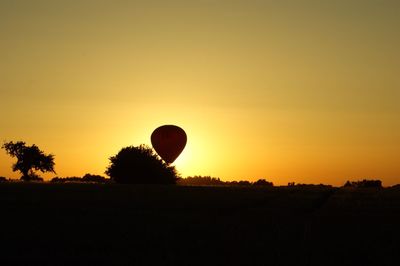 Scenic view of landscape against sky at sunset