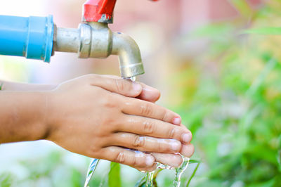 Close-up of woman holding hands