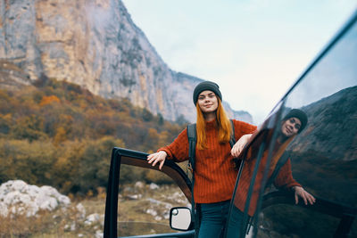 Young woman standing on mountain