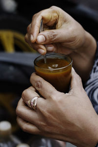 Close-up of man holding drink