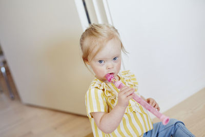 Girl holding flute
