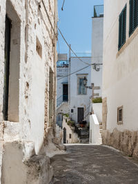 Street amidst buildings against sky