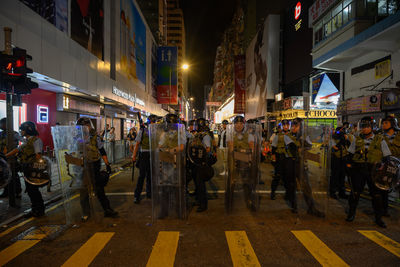 People on city street at night