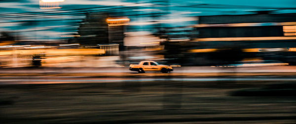 Blurred motion of car on road at night