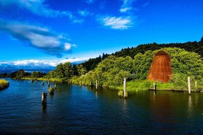 Scenic view of calm sea against blue sky