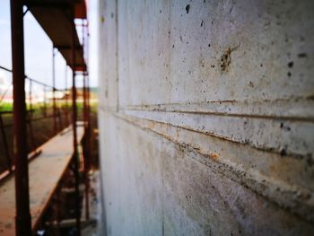 Close-up of rusty metal against sky