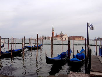 Boats moored in canal