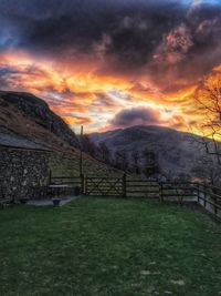 Scenic view of landscape against cloudy sky