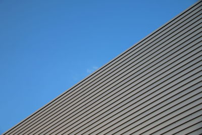 Low angle view of building against blue sky