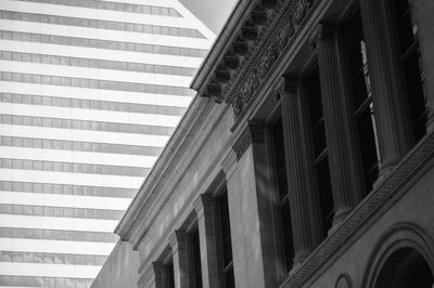 Low angle view of buildings in city against sky