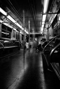 People on train at railroad station platform