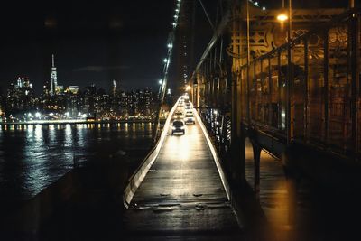 Illuminated street lights in city at night