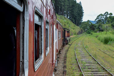 Train on railroad track against sky