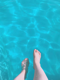 Low section of woman in swimming pool