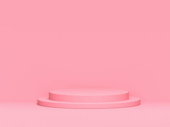 Close-up of empty seat against pink background