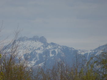 Scenic view of mountains against sky during winter
