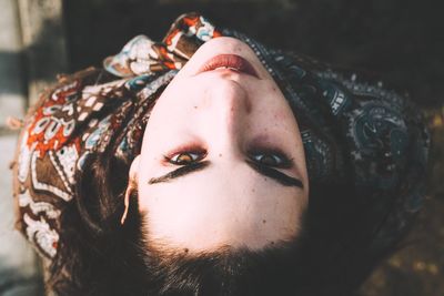 Directly above portrait of woman standing outdoors