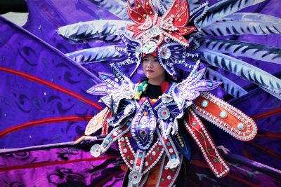 Woman dancing in traditional clothing during carnival