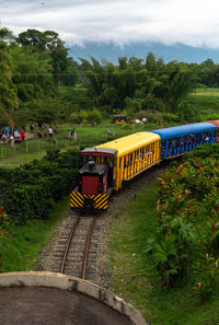 Train on railroad track against sky