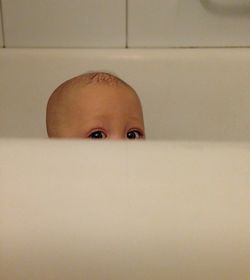 Portrait of child in bathtub