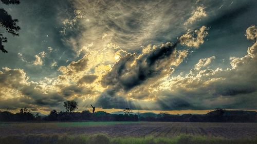 Scenic view of dramatic sky over land