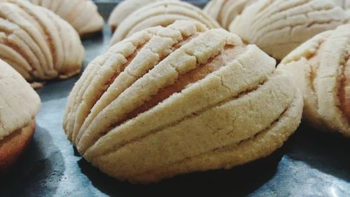 Close-up of conchas on baking sheet