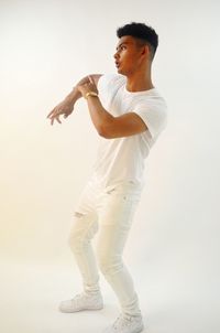 Man dancing against white background