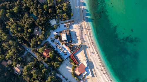 High angle view of swimming pool by building in city