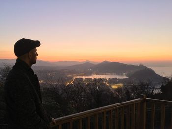 Man with cityscape in background