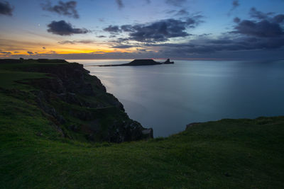 Scenic view of sea against sky at sunset