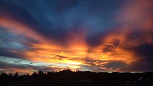 Scenic view of dramatic sky during sunset