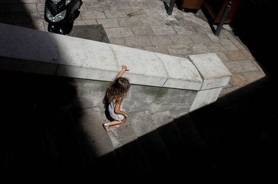 High angle view of person jumping outdoors