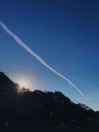 Low angle view of vapor trails in sky