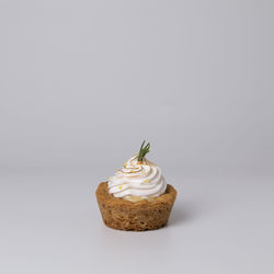 Close-up of cupcakes against white background