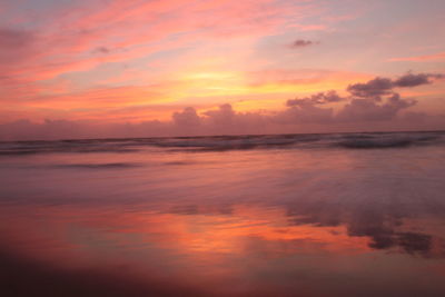 Scenic view of sea against romantic sky at sunset
