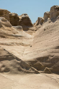 Rock formations in desert against clear sky